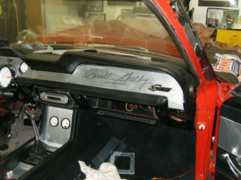 1968 Shelby GT350 - Dashboard of a 1968 Shelby GT350, Carroll Shelby's signature and various gauges.