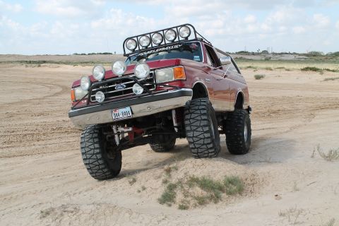 1990 Ford Bronco - This modified Ford Bronco is equipped for off-road adventures with extensive lighting and a raised suspension.