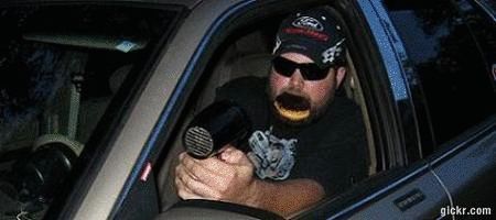 2000 Mercury Grand Marquis - Man inside a car appears to be holding a hairdryer as if it were a firearm.