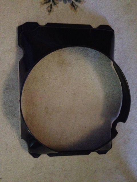 1979 Ford Bronco - This image shows a black plastic automotive part with a textured circular insert, not a 1979 Ford Bronco.