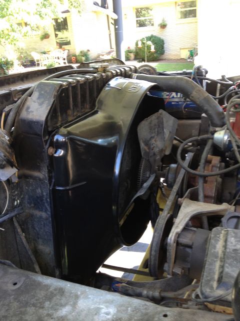 1979 Ford Bronco - Close-up view of the engine bay, focusing on the radiator and fan shroud assembly.