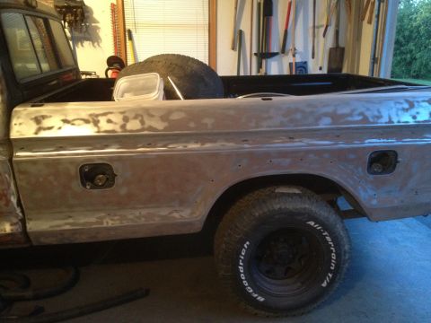 1979 Ford F-350 - Side view of a 1979 Ford F-350 pickup truck bed and fender, undergoing bodywork.