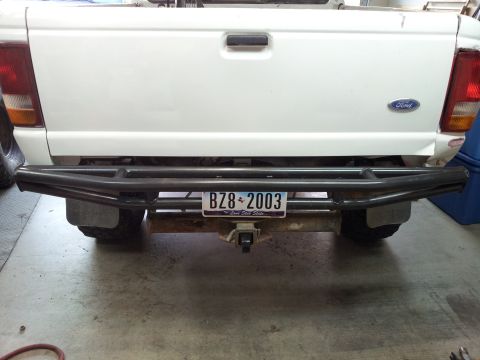 1994 Ford Ranger - Rear view of a white Ford Ranger pickup truck a custom metal bumper and a license plate from 2003.