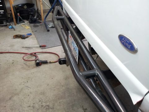1994 Ford Ranger - A close-up of a Ford truck's rear, showing a custom bumper and the Ford emblem.