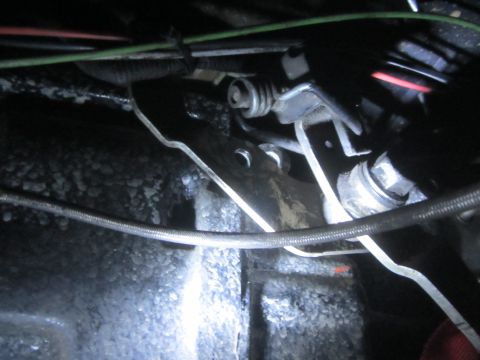 1997 Dodge 3500 - Transfer case linkage components visible in the undercarriage of a vehicle.
