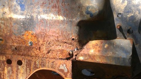 1978 Ford Bronco - This image shows a heavily rusted metal panel, with the Supermotors.net logo visible in the lower right corner.