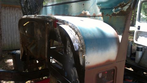 1978 Ford Bronco - This vehicle's front end shows significant rust and repair work, with the fender and hood in a state of disrepair.