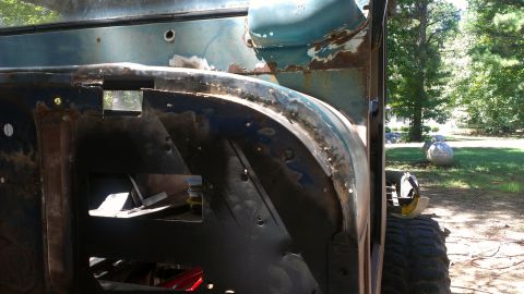 1978 Ford Bronco - This photo shows the damaged fender and wheel well of a vehicle, not a complete 1978 Ford Bronco.