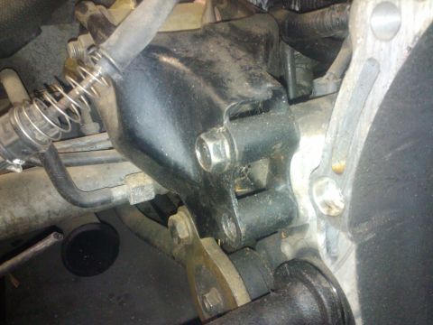 1995 Ford Probe - Engine mount bracket with attached hoses and springs, viewed from below.