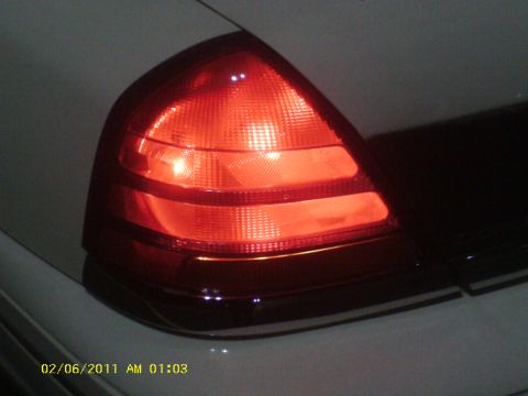 1998 Ford Crown Victoria - Close-up of a 1998 Ford Crown Victoria's illuminated taillight.