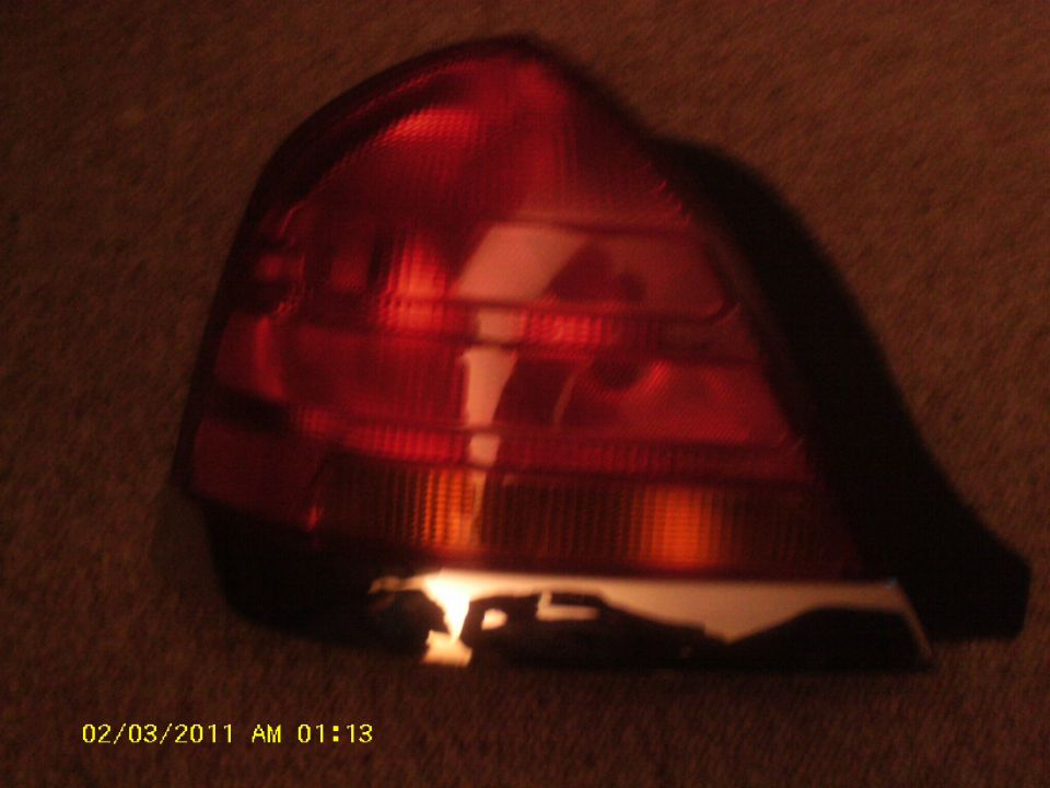 Red taillight assembly with amber turn signal section