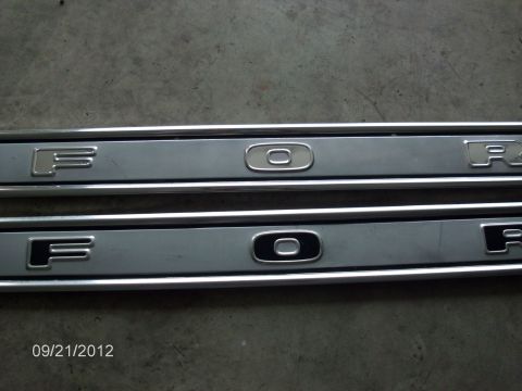 1979 Ford F-150 - Close-up of two Ford door sill plates, showing the embossed lettering.