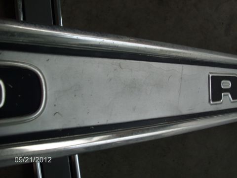 1979 Ford F-150 - Close-up of chrome trim with partial lettering.