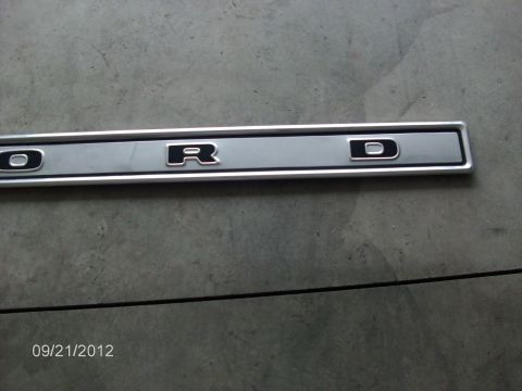 1979 Ford F-150 - A close-up view of a Ford emblem trim piece, showing the letters 'O', 'R', and 'D'.