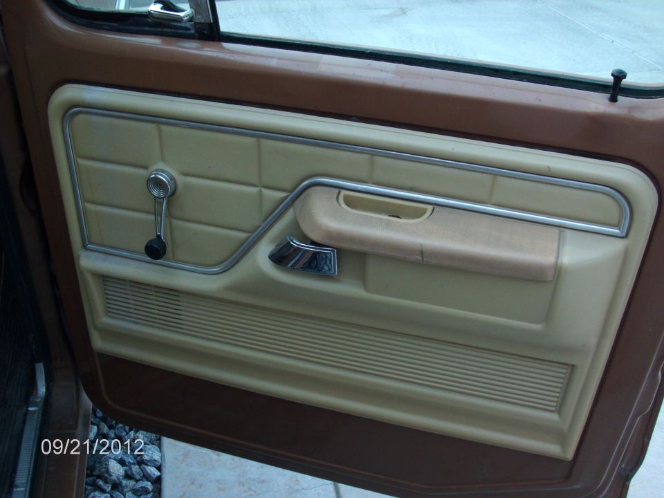 1979 Ford F-150 interior door panel with tan upholstery and chrome accents
