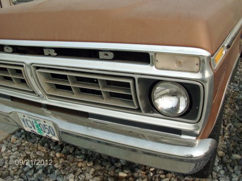 1979 Ford F-150 - Close-up of the front grille and headlight of a brown Ford F-150, showing the Oregon license plate.