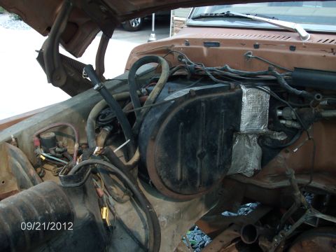 1979 Ford F-150 - Close-up view of the engine bay, showing various hoses, wiring, and components. The date 09/21/2012 is visible.