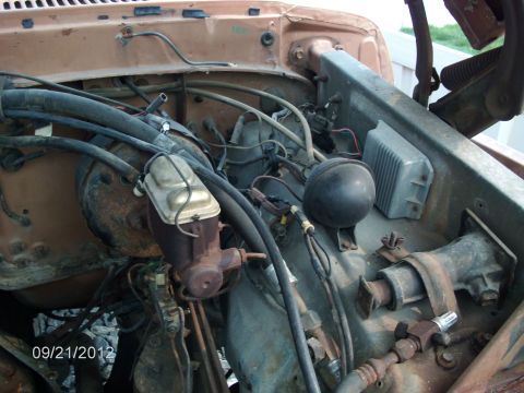 1979 Ford F-150 - Engine bay view of a 1979 Ford F-150, showing the brake master cylinder and associated plumbing.