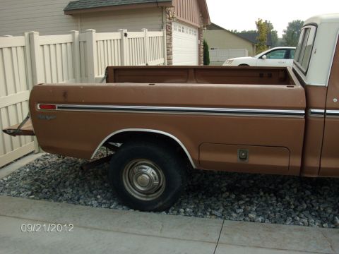 1979 Ford F-150 - This pickup truck, possibly a Ford Ranger, is parked on gravel in front of a house and garage.
