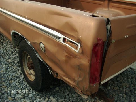1979 Ford F-150 - This 1979 Ford F-150 shows severe damage to its rear passenger side quarter panel and taillight assembly.