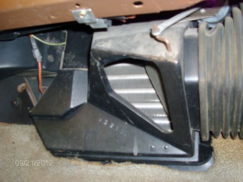 1979 Ford F-150 - Close-up view of a vehicle's heater core and associated ducting, showing the numbers '321' marked on the housing.