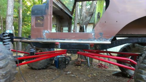 1978 Ford Bronco - A heavily modified vehicle chassis is shown with extensive suspension work and a partial body, suggesting a custom build.