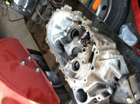 1993 Ford Probe - Transmission housing disassembled, showing internal gears and shafts.