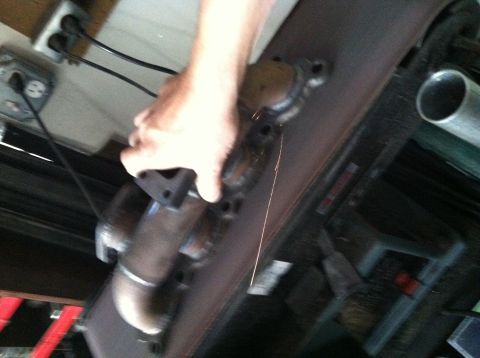 1993 Ford Probe - Working on an exhaust manifold, sparks flying from the metal part.