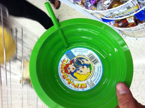 1993 Ford Probe - Close-up of a green plastic bowl designed for children, a built-in straw.