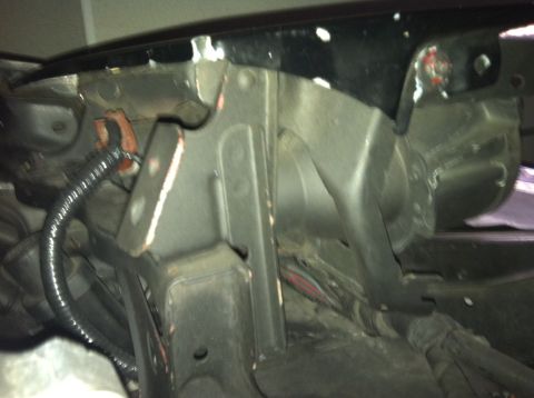 1993 Ford Probe - Underside view of a vehicle's front frame and wiring, showing structural components and electrical connections.