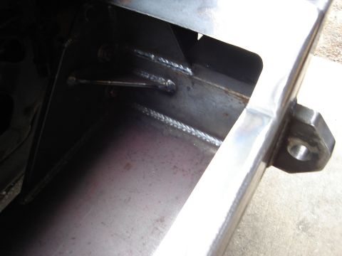 1989 Ford Bronco - Close-up of a custom-fabricated winch bumper, showing welded seams and a mounting point for a tow hook.