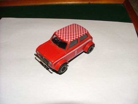 1980 MINI Cooper - This red toy car features a checkered roof and racing stripe with the number 1. The registry claims it is a 1980 MINI Cooper, but this is u…