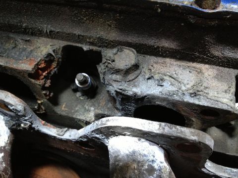 1979 Ford F-350 - Spark plug installed in a heavily corroded engine block.