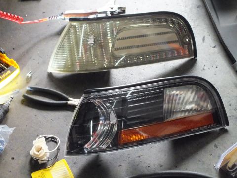 2003 Ford Crown Victoria - Close comparison of a clear-lens corner lamp and a black-housing corner lamp with amber reflector.