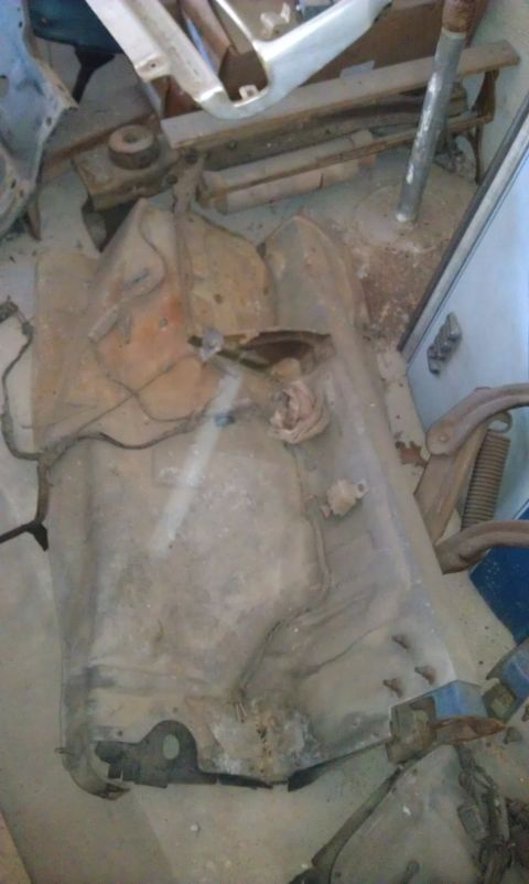 1974 Oldsmobile 442 - A rusty, unidentifiable car part is shown in this overhead view, with a watermark at the bottom.