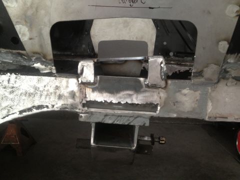 1965 Ford Mustang - Custom metalwork is visible on the vehicle's frame, showing modifications and welds.