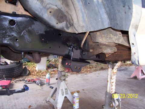 1990 Ford Bronco - Underbody view of vehicle frame and suspension parts during maintenance or repair.