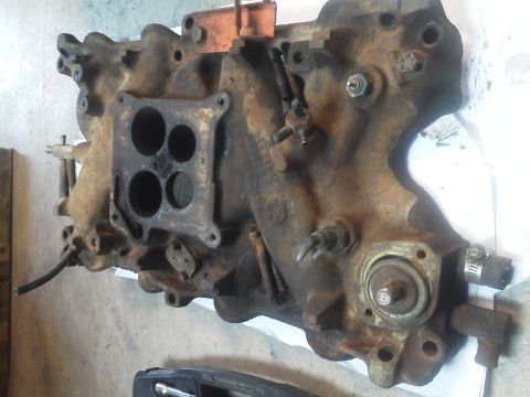 1979 Ford F-150 - Engine intake manifold with visible corrosion and hose connections.