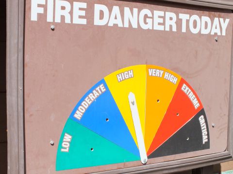 2003 Ford Crown Victoria - Wildfire danger gauge sign reading Low to Critical, needle set on High.