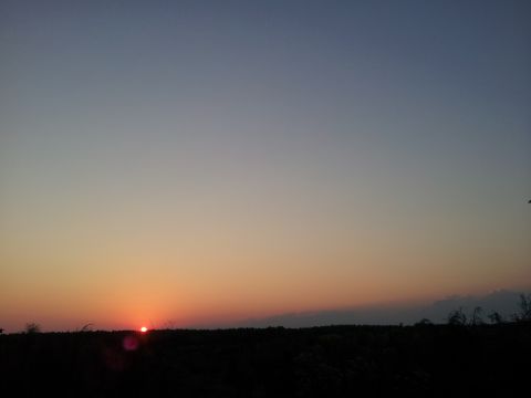 1986 Ford Bronco - Sunset over a dark landscape. SUPERMOTORS.NET logo visible.