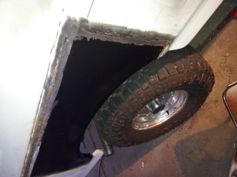 1996 Ford Bronco - The wheel well shows signs of rust and repair work, with the tire visible.