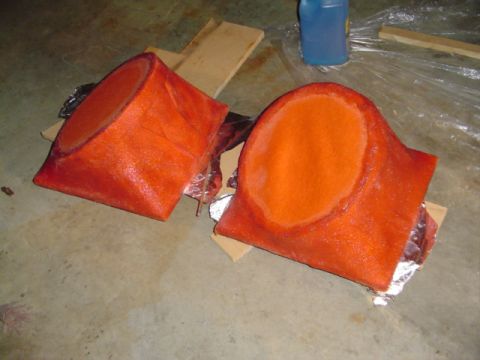 1999 Ford Taurus - Custom speaker enclosures are shown on a concrete floor, possibly for a vehicle interior modification.