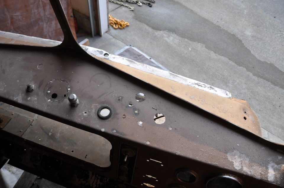 Dashboard interior with various holes and mounting points