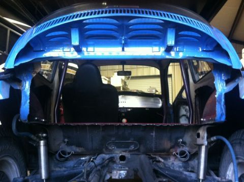 1970 Volkswagen Beetle - Rear view of a 1970 Volkswagen Beetle undergoing modifications, showing the interior and chassis.