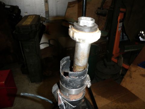 1961 International Scout 800 - A section of a steering column is shown disassembled, with various metal and plastic parts visible.