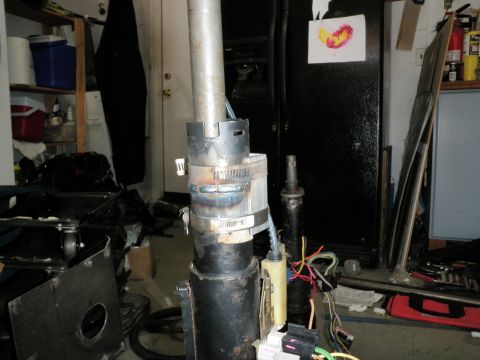 1961 International Scout 800 - A close-up view of a steering column assembly, showing welded sections and exposed electrical wiring.