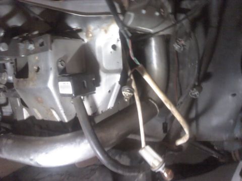 1995 Ford Probe - Undercarriage view of a vehicle, focusing on exhaust and wiring components.
