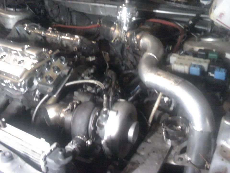 engine bay with turbocharger and intake piping