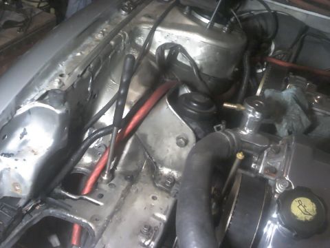 1995 Ford Probe - Close-up view of engine bay components, including hoses and wiring.