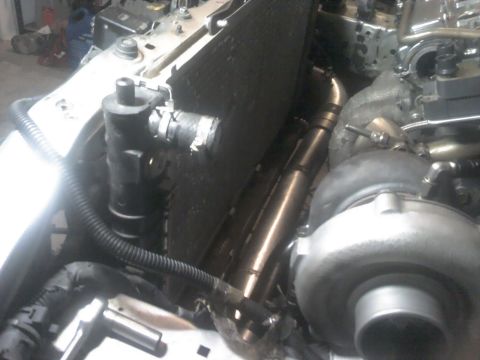 1995 Ford Probe - This image shows a turbocharger and radiator assembly within a vehicle's engine bay.